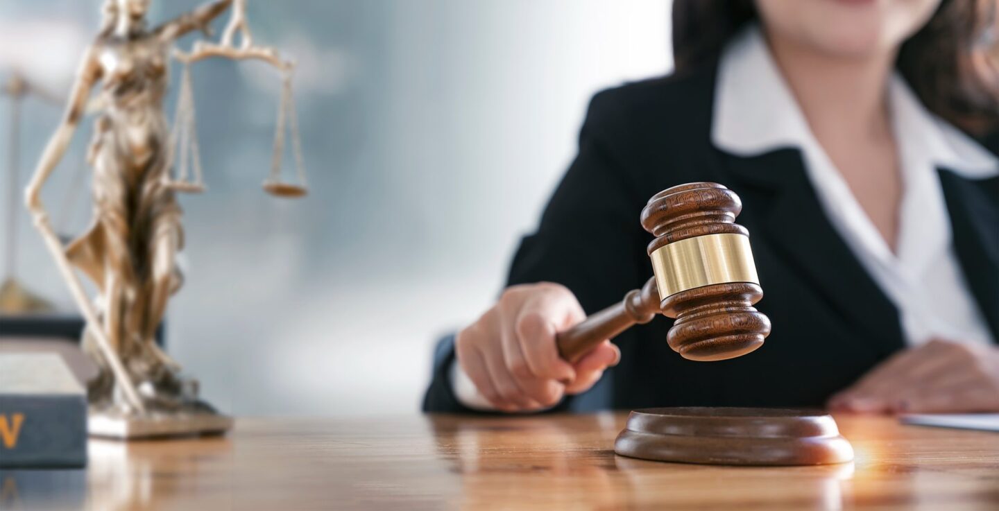Woman hand holding a gavel